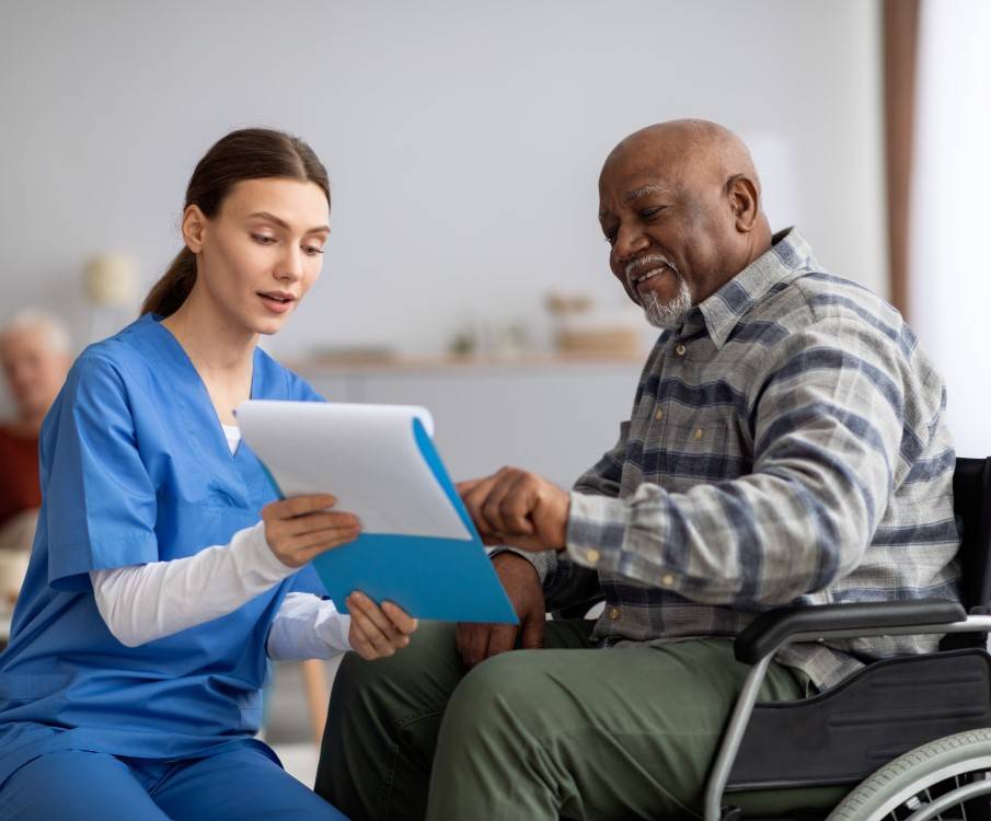 patient in wheelchair with nurse